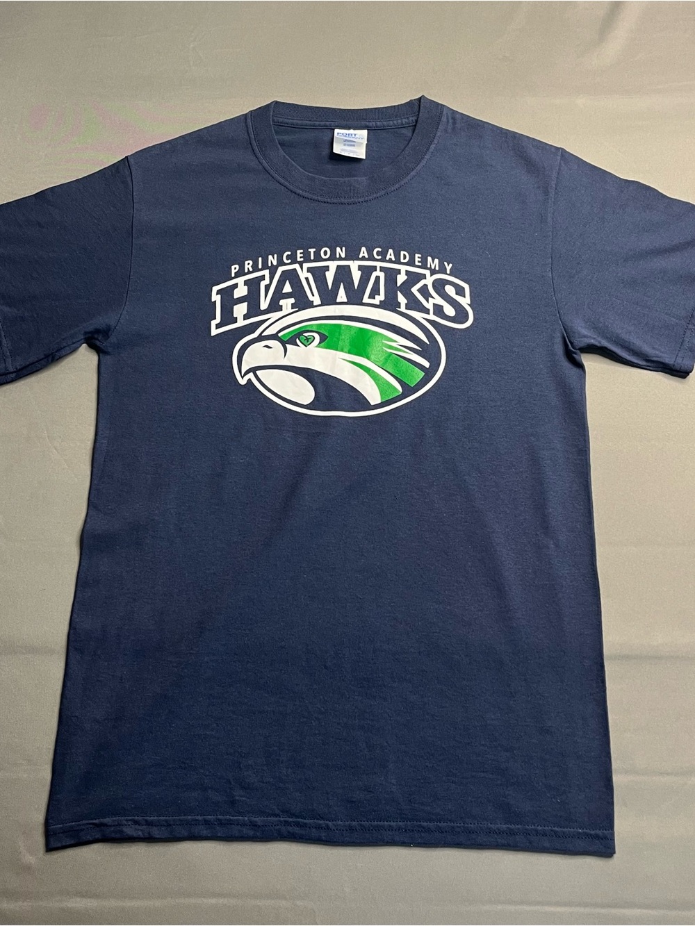 Port and Company Navy Tee with Green and White Princeton Academy Hawks Graphic
